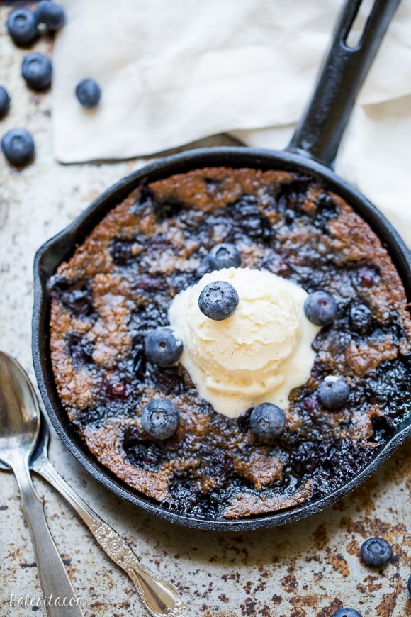 This Blueberry Skillet Cookie is a cross between a gooey skillet cookie and a bubbly blueberry cobbler! This recipe is gluten-free, Paleo and refined sugar free and makes just enough to share.