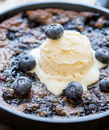 This Blueberry Skillet Cookie is a cross between a gooey skillet cookie and a bubbly blueberry cobbler! This recipe is gluten-free, Paleo and refined sugar free and makes just enough to share.