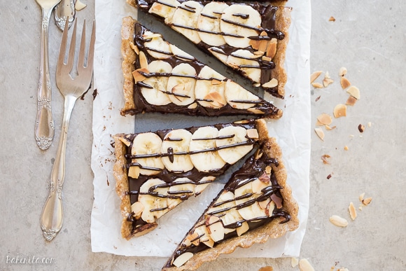 This No-Bake Chocolate Banana Tart has an easy date crust, filled with creamy chocolate ganache and sliced bananas! This quick and simple recipe is only has five ingredients and it's gluten-free, Paleo and vegan.