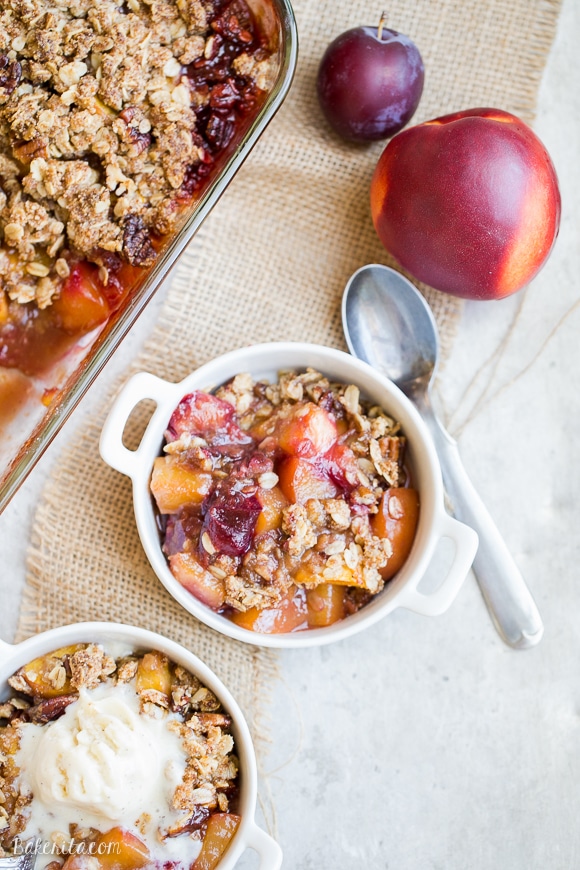 This Summer Stone Fruit Crisp features lightly sweetened peaches, plums, and nectarines topped with a oatmeal pecan crumble topping. This gluten-free and vegan dessert showcases the best of summer!