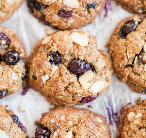 Almond Blueberry Breakfast Cookies are a quick and healthy breakfast treat, snack, or dessert. These hearty breakfast cookies, made with rolled oats and almond butter, are gluten free, refined sugar free, and bursting with fresh blueberries!