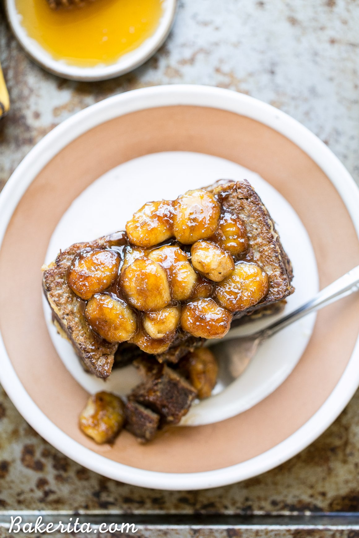 This Banana Bread French Toast is topped with caramelized bananas for a banana lover's delight! This gluten-free, Paleo, and dairy-free french toast is sure to satisfy your breakfast and brunch cravings.