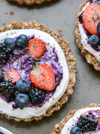 These Granola Crust Breakfast Tarts are topped with Greek yogurt and fresh berries for a fun and filling breakfast! This gluten-free and refined sugar-free twist on a classic parfait looks beautiful and tastes even better.