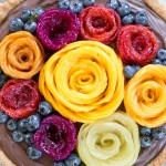 This Chocolate Mousse Tart with Coconut Crust + Fresh Fruit Flowers has the most incredible vegan chocolate mousse filling! You'd never guess that this rich dessert is gluten-free, Paleo, and vegan.