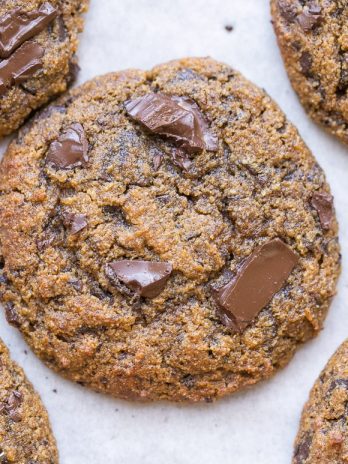 These Pumpkin Chocolate Chunk Cookies are made with browned butter and flavored with cinnamon, nutmeg + cloves! You'll love the big dark chocolate chunks in these gluten-free + grain-free cookies.