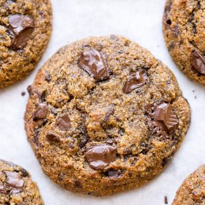 These Pumpkin Chocolate Chunk Cookies are made with browned butter and flavored with cinnamon, nutmeg + cloves! You'll love the big dark chocolate chunks in these gluten-free + grain-free cookies.