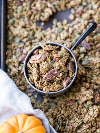 This Pumpkin Granola is a simple, crunchy granola that makes the perfect Fall breakfast! Made with pecans, pepitas, and maple syrup, you won't be able to stop snacking on this gluten free and vegan granola.