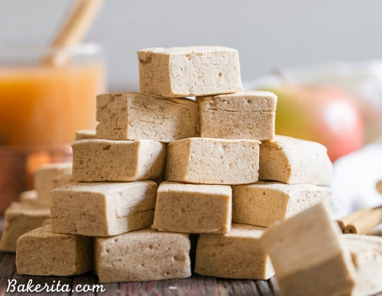 These Paleo Apple Spice Marshmallows are sweetened with maple syrup and flavored with apple juice + loads of warm spices! Homemade marshmallows are easier than you'd think, and you'll love these on their own or as the perfect apple cider addition.