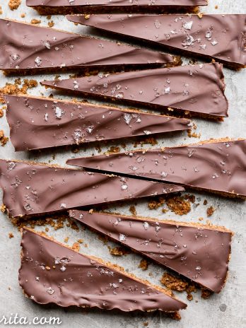 These Brown Butter Shortbread are crisp and buttery with dark chocolate + flaky sea salt on top. These gluten free & refined sugar free cookies melt in your mouth and make the perfect addition to your holiday cookie tray!