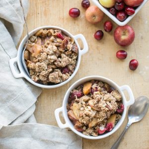 This Cranberry Apple Crisp is spiced with cinnamon, nutmeg & orange zest and topped with a crunchy pecan oatmeal crisp topping. This gluten-free and vegan crisp is the perfect holiday dessert!