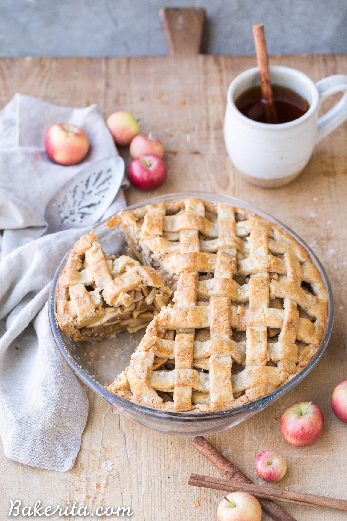 This Paleo Apple Pie has a flaky gluten-free lattice crust with a delicious spiced apple filling! Your holiday dessert table isn't complete without apple pie, and this healthier refined sugar free recipe will satisfy any apple pie lover.