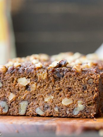 This Paleo Persimmon Bread is a healthy treat that uses pureed Fuyu persimmons for flavor and moisture, and is loaded with toasted walnuts & golden raisins! This gluten-free persimmon bread is spiced with cinnamon, ginger and allspice and makes a perfect breakfast or snack.