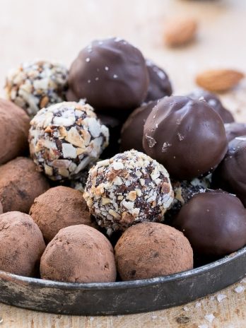 With toasted almonds for crunch and a sprinkle of sea salt on top, these Salted Almond Chocolate Truffles are a chocolate lover's dream! They're easy to make, Paleo-friendly, and vegan. A batch of these truffles makes the perfect holiday gift.