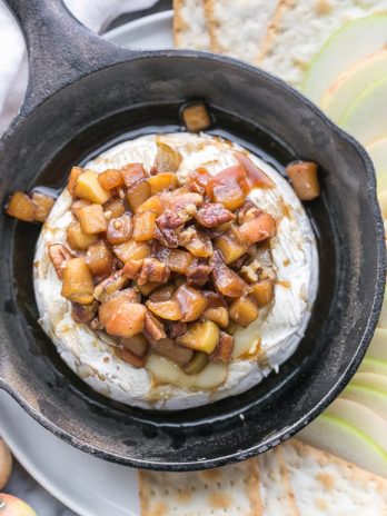 Caramel Apple Baked Brie is a gooey, scrumptious appetizer that's perfect for holiday entertaining! This easy recipe has a caramel apple topping piled on top of wheel of melted brie. It only has 5 ingredients and takes 20 minutes from start to finish.