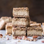 These Gluten Free Pecan Praline Cheesecake Bars will be your new favorite dessert! The super creamy cheesecake filling has a sweet + crunchy pecan praline topping.