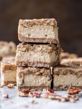 These Gluten Free Pecan Praline Cheesecake Bars will be your new favorite dessert! The super creamy cheesecake filling has a sweet + crunchy pecan praline topping.