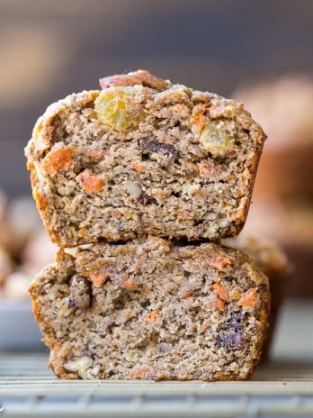 These Paleo Morning Glory Muffins are loaded with bananas, shredded carrots, toasted walnuts, and golden raisins. These easy muffins have NO added sugar - they're sweetened entirely with bananas! They're the perfect on-the-go breakfast or snack.
