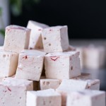 These Paleo Peppermint Marshmallows are exactly what your hot chocolate needs! They're light, fluffy, and easier to make than you'd think. This recipe is Paleo + refined sugar free, with a beautiful swirl of homemade red food coloring!