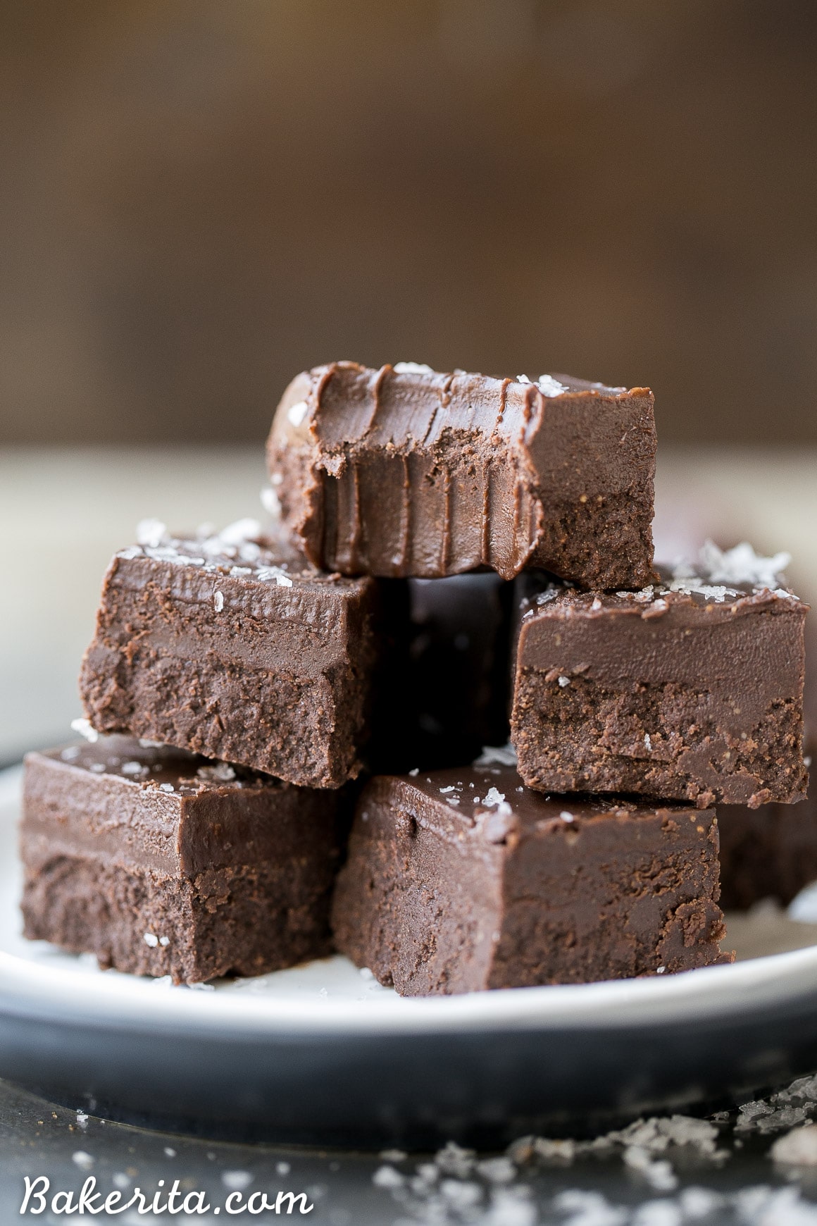This Chocolate Fudge is incredibly smooth, rich and chocolatey. It's made with only four wholesome ingredients, there's no cooking required, and it's Paleo + vegan! It's the perfect holiday treat.