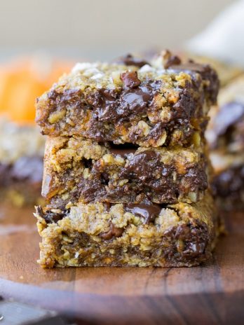 These Pumpkin Oatmeal Scotchie Bars with Chocolate Chips + Pecans are soft, gooey, and absolutely irresistible! These decadent dessert bars couldn't be easier to make.