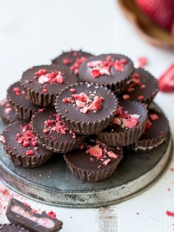 These Chocolate Strawberry Cups have a creamy strawberry + coconut butter filling encased in homemade chocolate! These gluten-free, Paleo + vegan candy cups will satisfy your sweet tooth more healthfully.