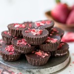 These Chocolate Strawberry Cups have a creamy strawberry + coconut butter filling encased in homemade chocolate! These gluten-free, Paleo + vegan candy cups will satisfy your sweet tooth more healthfully.