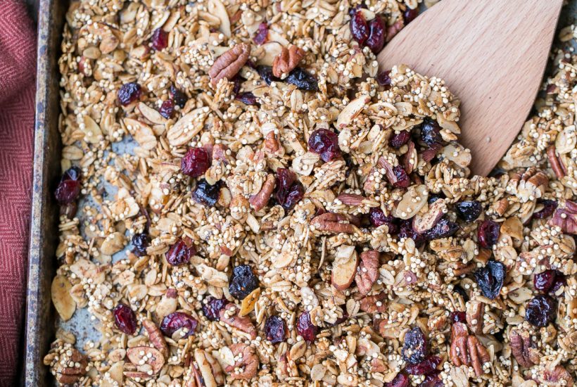 This Quinoa Granola is a nutty, crunchy breakfast or snack option that's packed with whole grains and protein. This maple-sweetened granola is gluten-free and vegan, with cinnamon and dried cranberries for flavor! The quinoa bakes up into delicious clusters.