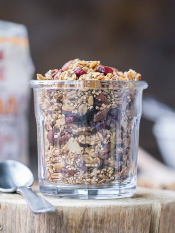 This Quinoa Granola is a nutty, crunchy breakfast or snack option that's packed with whole grains and protein. This maple-sweetened granola is gluten-free and vegan, with cinnamon and dried cranberries for flavor! The quinoa bakes up into delicious clusters.