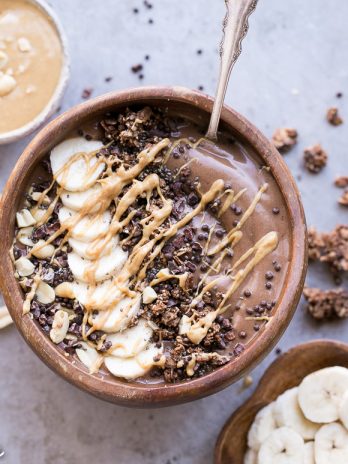This Chocolate Peanut Butter Banana Smoothie Bowl tastes like a peanut butter cup, but it's actually a filling, superfood-packed breakfast that comes together in just 5 minutes! This gluten-free + vegan smoothie bowl is the perfect way to start the day.
