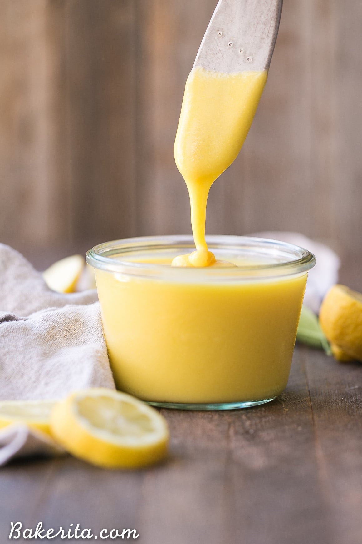 This Paleo Lemon Curd is easy to make, super silky, and perfectly tart. It's a refined sugar free honey-sweetened recipe made with just five ingredients. It's perfect to drizzle on pancakes or waffles, swirl into your yogurt, use it in baked goods, or just eat it with a spoon!