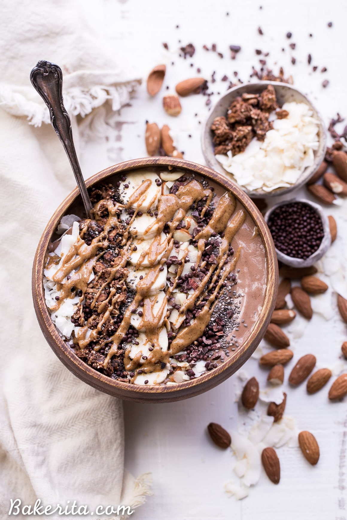 This Almond Chocolate Coconut Smoothie Bowl is refreshing and chocolatey - it's an absolutely delicious way to start the day! This easy recipe is gluten-free, vegan, and comes together in 5 minutes.