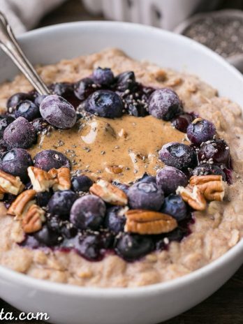 This simple Blueberry Muffin Oatmeal is sweetened with a banana, spiced with cinnamon and topped with an easy blueberry compote! Top with all your favorite toppings for a delicious, healthy + filling breakfast that is far from boring.