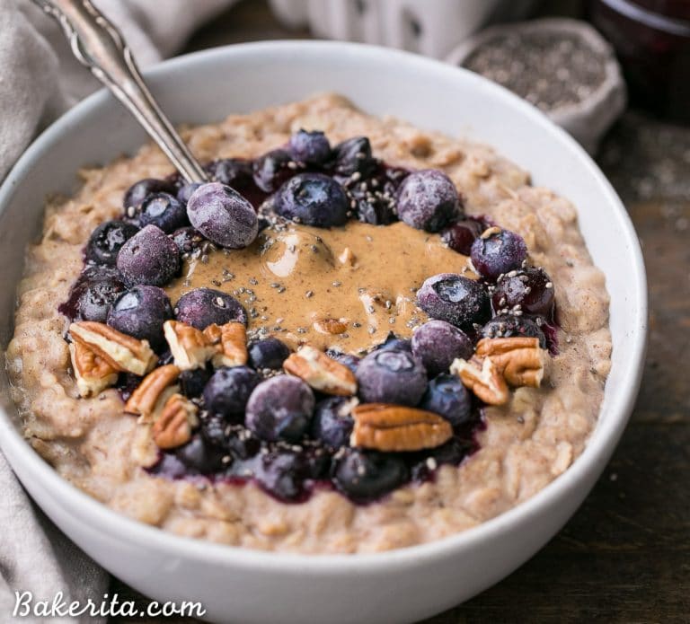 This simple Blueberry Muffin Oatmeal is sweetened with a banana, spiced with cinnamon and topped with an easy blueberry compote! Top with all your favorite toppings for a delicious, healthy + filling breakfast that is far from boring.
