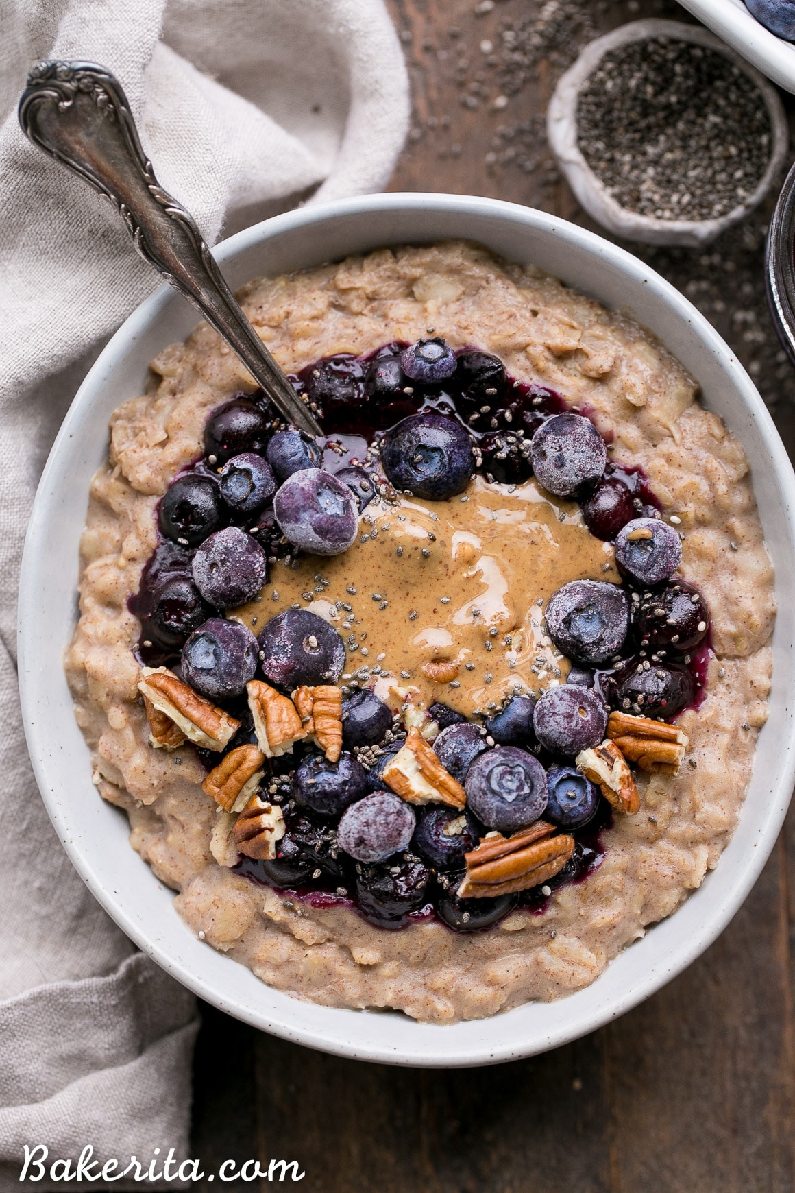 This simple Blueberry Muffin Oatmeal is sweetened with a banana, spiced with cinnamon and topped with an easy blueberry compote! Top with all your favorite toppings for a delicious, healthy + filling breakfast that is far from boring. 