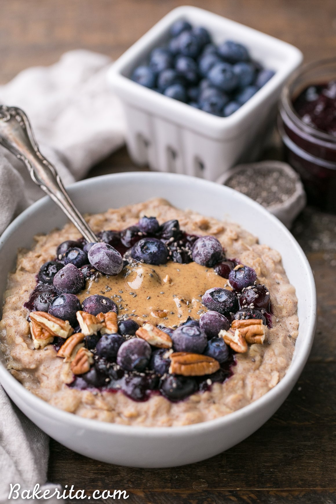This simple Blueberry Muffin Oatmeal is sweetened with a banana, spiced with cinnamon and topped with an easy blueberry compote! Top with all your favorite toppings for a delicious, healthy + filling breakfast that is far from boring. 