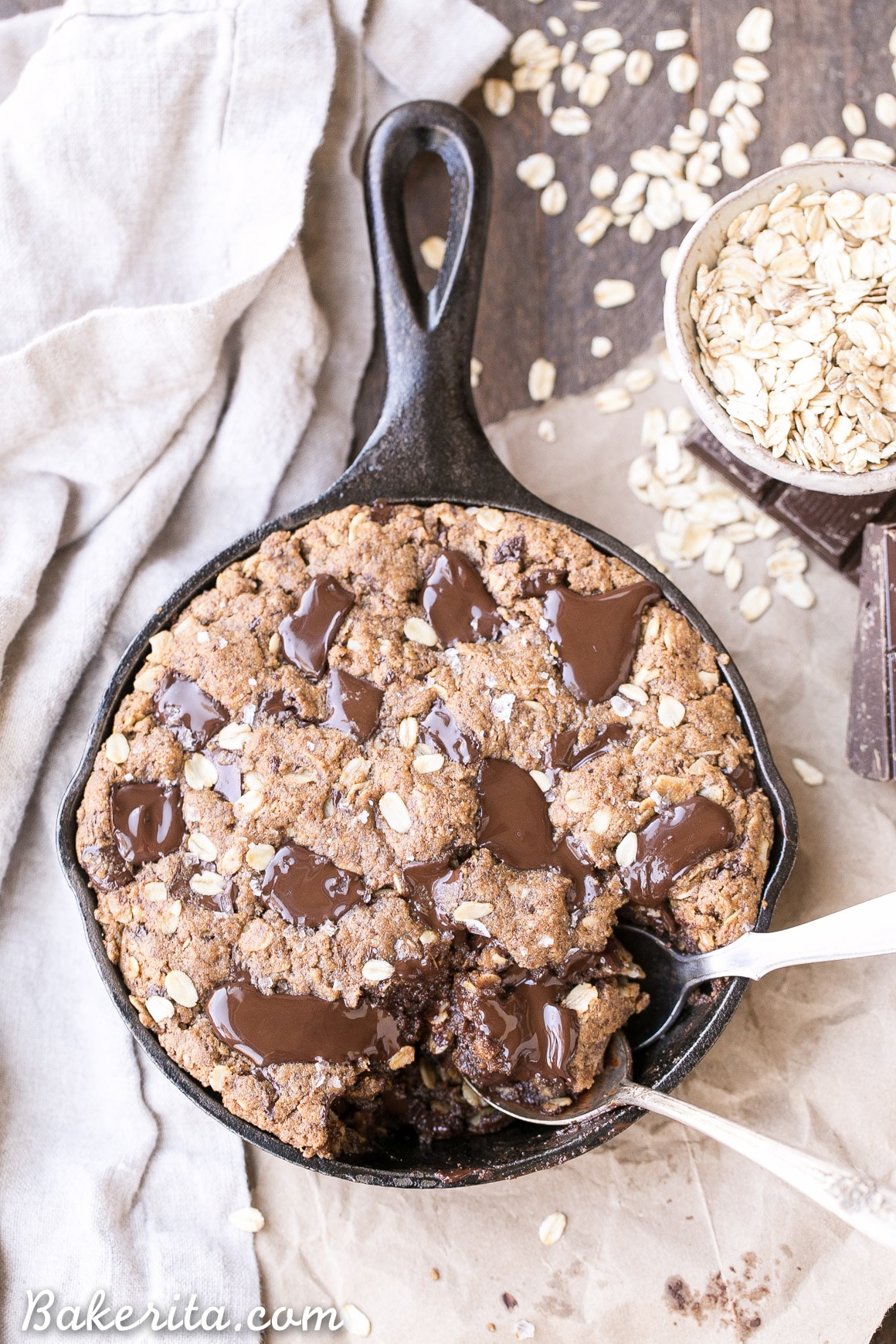 This Oatmeal Chocolate Chip Skillet Cookie is the ultimate thick, gooey oatmeal cookie! This gluten-free and vegan dessert is loaded with gooey chocolate. This one is sure to satisfy your chocolate cravings!