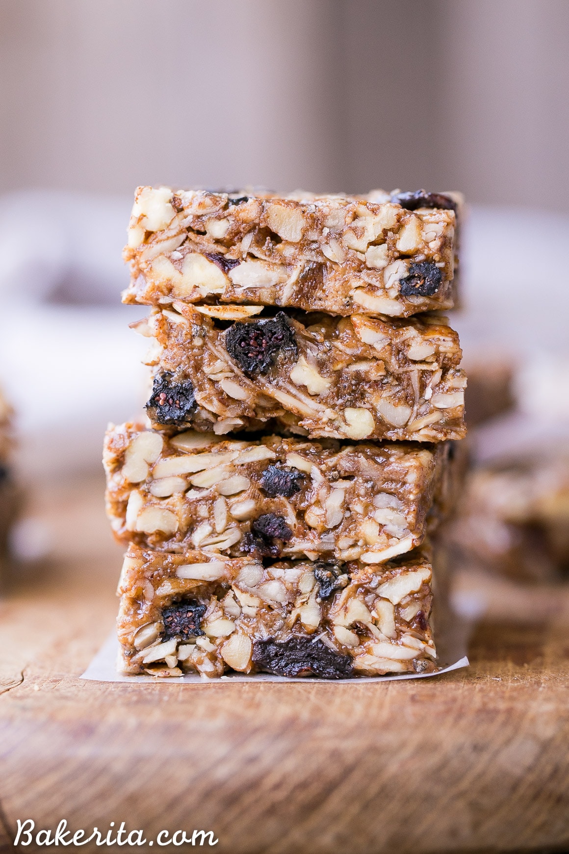 These No-Bake Trail Mix Granola Bars are loaded with nuts, coconut, and dried fruit for a filling and delicious snack that will fill you up and satisfy your tastebuds! These Paleo + vegan granola bars are the perfect thing to keep on hand for when hunger hits.
