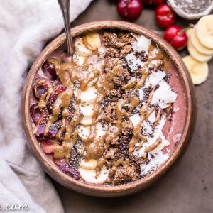 This Banana Cherry Smoothie Bowl is a healthy and delicious breakfast treat! It's refreshing, filling, and loaded with beautifying superfoods. Add all your favorite toppings for a treat suited just to your tastes.