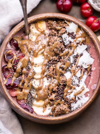 This Banana Cherry Smoothie Bowl is a healthy and delicious breakfast treat! It's refreshing, filling, and loaded with beautifying superfoods. Add all your favorite toppings for a treat suited just to your tastes.