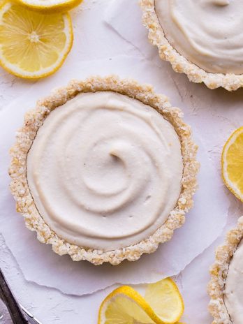 These No-Bake Lemon Tarts are easy to make with tart lemon flavor. The super creamy and bright lemon filling is perfectly complimented by the lemony cashew coconut crust. These gluten-free, Paleo and vegan tarts are perfect for warm days!