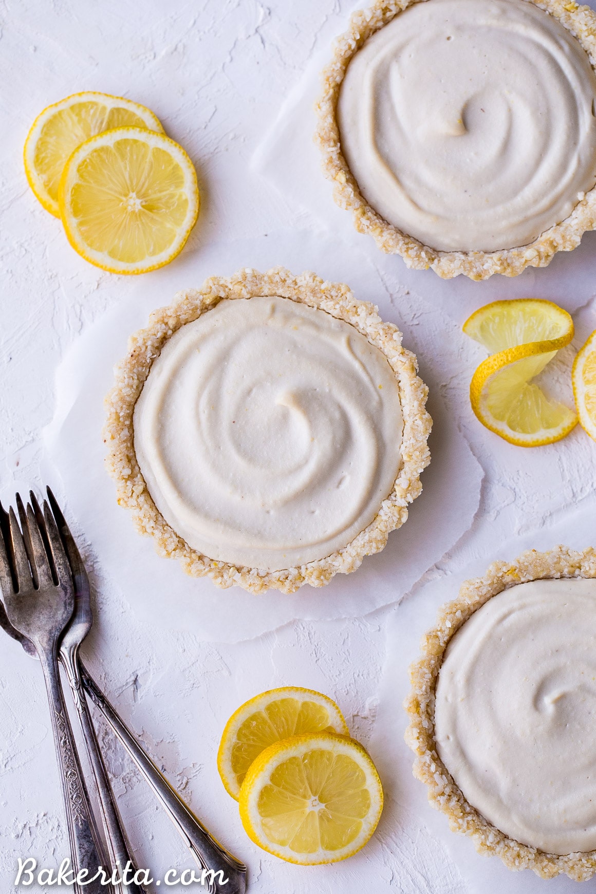 These No-Bake Lemon Tarts are easy to make with tart lemon flavor. The super creamy and bright lemon filling is perfectly complimented by the lemony cashew coconut crust. These gluten-free, Paleo and vegan tarts are perfect for warm days!