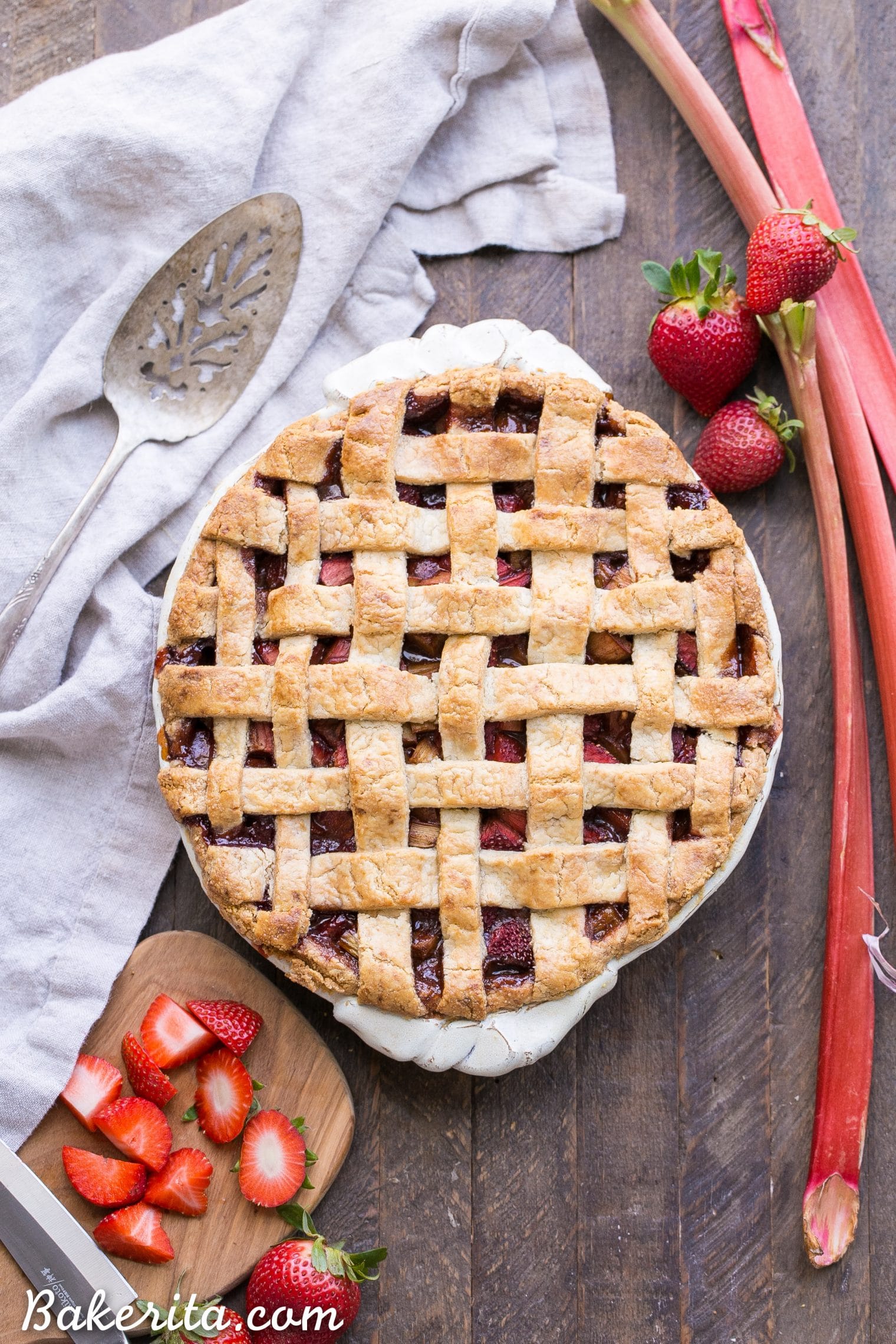 This Paleo Strawberry Rhubarb Pie is bursting with fresh strawberries and rhubarb, creating a delectable tart + sweet pie! The crisp and flaky gluten-free + grain-free crust is the perfect vessel for the lightly spiced fruit filling. 