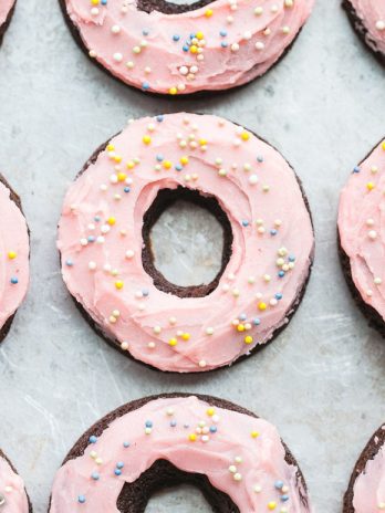 These Chocolate Beet Donuts are incredibly moist and chocolatey, with a naturally pink-tinted beet frosting on top! These gluten-free, paleo and dairy-free donuts make the perfect indulgent breakfast, snack, or dessert.