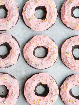 These Chocolate Beet Donuts are incredibly moist and chocolatey, with a naturally pink-tinted beet frosting on top! These gluten-free, paleo and dairy-free donuts make the perfect indulgent breakfast, snack, or dessert.