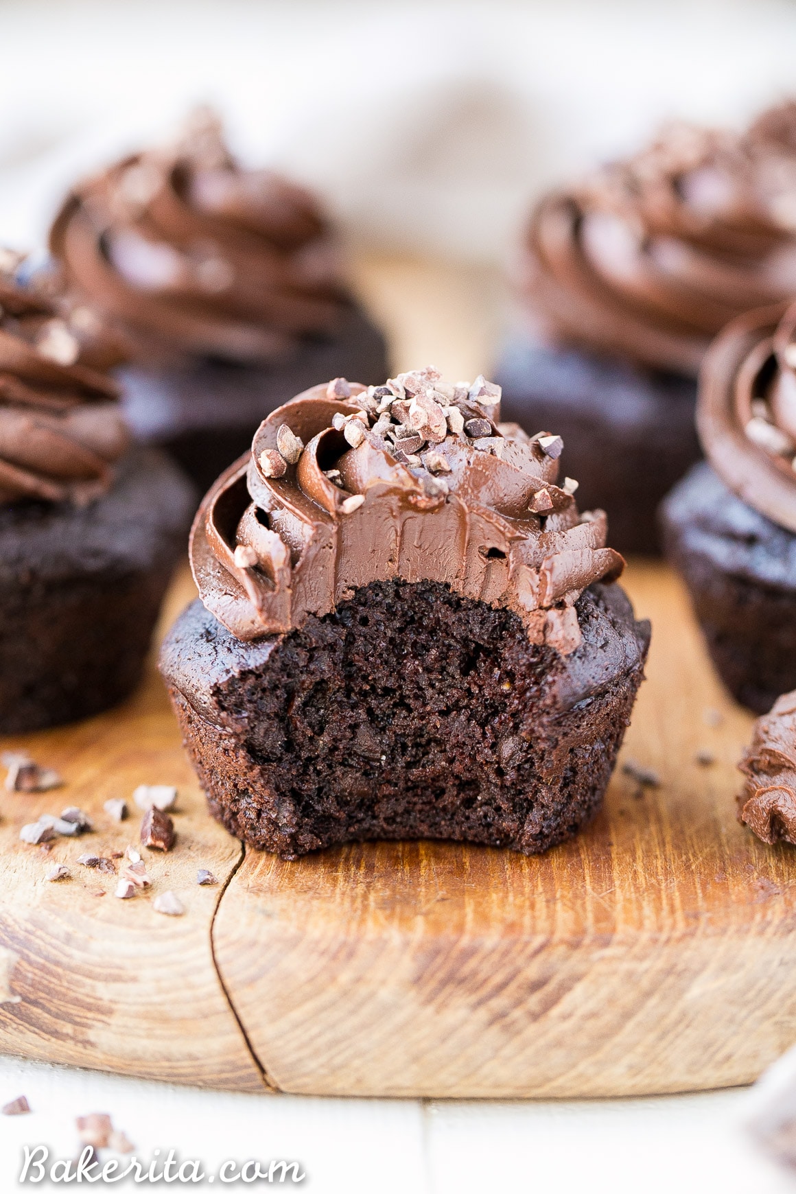 These Paleo Chocolate Zucchini Cupcakes are topped with a rich and fudgy Paleo Chocolate Frosting! You'd never guess there are veggies packed into these super moist and chocolatey cupcakes.
