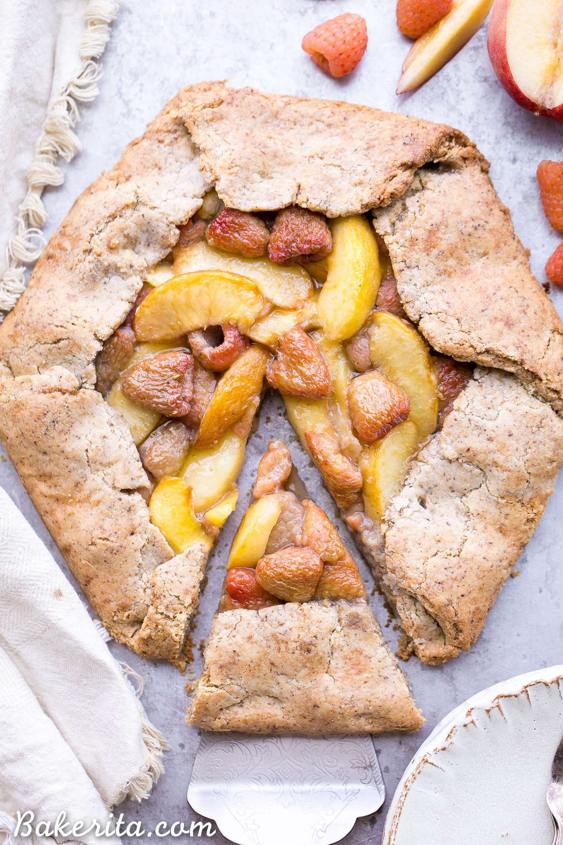 This Peach Raspberry Galette highlights two of summer's best fruits. The fresh peaches and raspberries are tucked into the flakiest paleo and vegan pie crust I've ever had!