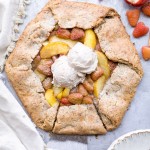 This Peach Raspberry Galette highlights two of summer's best fruits. The fresh peaches and raspberries are tucked into the flakiest paleo and vegan pie crust I've ever had!