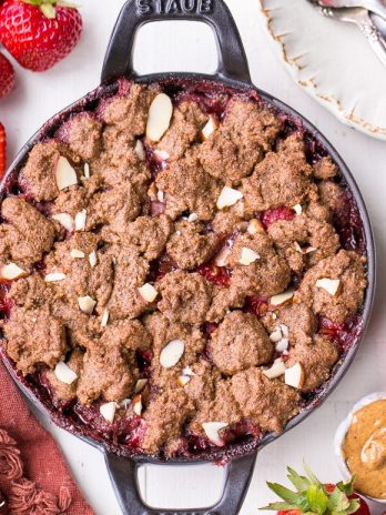 This Strawberry Crisp with Almond Butter Crumble is an irresistible pairing of fresh strawberries and a lightly-sweetened, rich and crispy almond butter cookie crumble. You won't be able to resist this gluten-free, paleo, and vegan dessert.