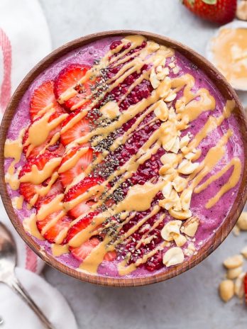 This Peanut Butter & Jelly Smoothie Bowl is smooth, creamy, and delicious - the flavors will bring you right back to your favorite childhood sandwich. This gluten-free and vegan breakfast bowl has a secret vegetable ingredient packed in too - shhh!