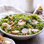 This Kale & Salami Salad with Roasted Garlic Vinaigrette is loaded with roasted fingerling potatoes, crispy toasted chickpeas, golden raisins, and caramelized onions! This filling salad makes the perfect lunch or dinner. It's gluten free and dairy free, with a Paleo option.
